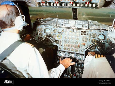 Concorde pilots in cockpit, 1975. Concorde was a supersonic passenger ...