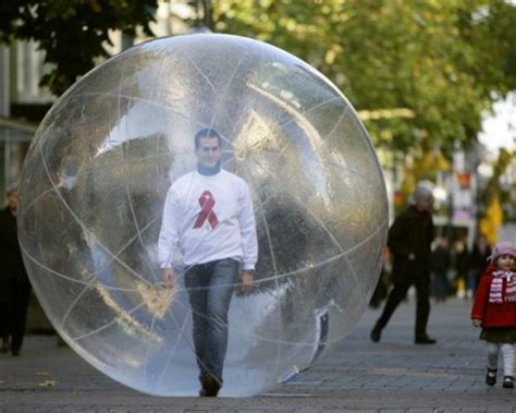 In pictures: A man walks through downtown Cologne in a plastic ball as part of the "Man in the ...