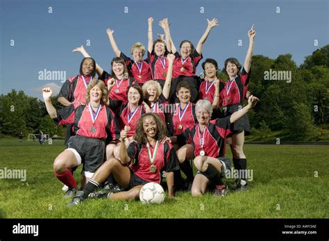 Female soccer team celebrating Stock Photo - Alamy