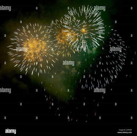 Fire crackers bursting in the sky at night Stock Photo - Alamy