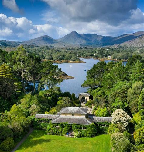 The Italianate House and Gardens of Garnish Island overlooking the Caha Mountains, Bantry Bay ...