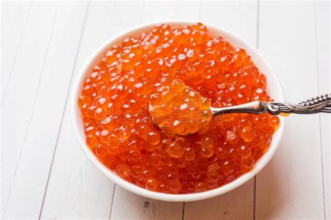Red Salmon Caviar in a Plate on a White Table Stock Photo - Image of ...
