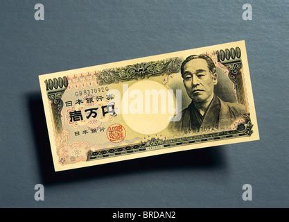 Japanese 10,000 yen banknotes overlapping each other in a long line on ...