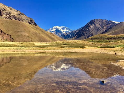 Scenic View of Mountains Under Clear Sky · Free Stock Photo