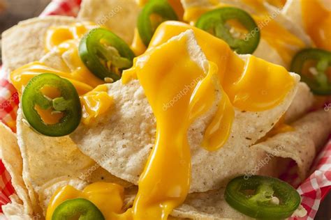 Homemade Nachos with Cheddar Cheese — Stock Photo © bhofack2 #65538631