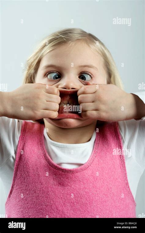 A little girl making a scary face Stock Photo - Alamy