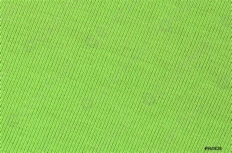 The texture of the fabric is bright green Material for - stock photo ...