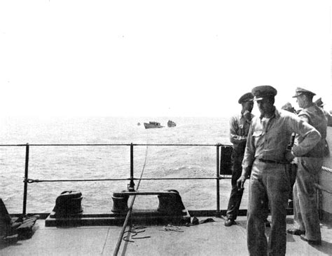 [Photo] Captured German submarine U-505 with salvage crew on deck (distance) being taken under ...