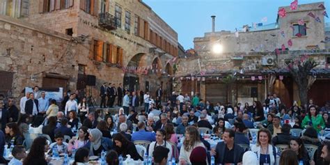 President Al-Assad and Mrs. Asma Al-Assad participate in a mass Iftar in Tartous old city ...