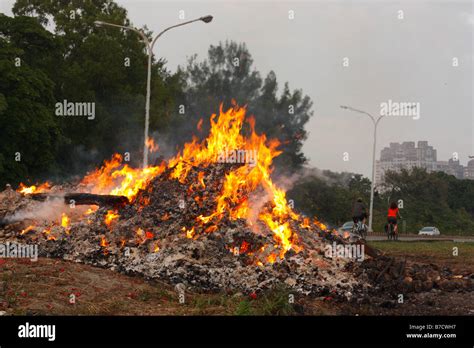 A trash fire burning Stock Photo - Alamy