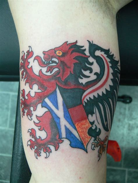 Scotland tattoo lion with flag on arm - Tattooimages.biz