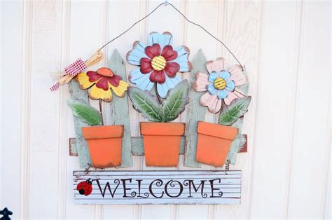 Welcome Sign with Metal Colorful Flowers Stock Photo - Image of ancient ...