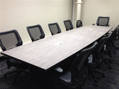 A large conference table complete with power outlets and USB ports. | Custom cabinetry, Large ...