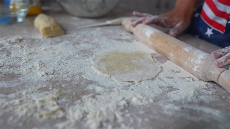 Rolling dough with rolling pin 16089947 Stock Video at Vecteezy