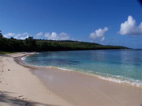 the beach is clear and blue with white sand