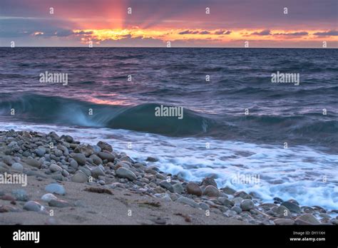 Sea beach on sunset time Stock Photo - Alamy