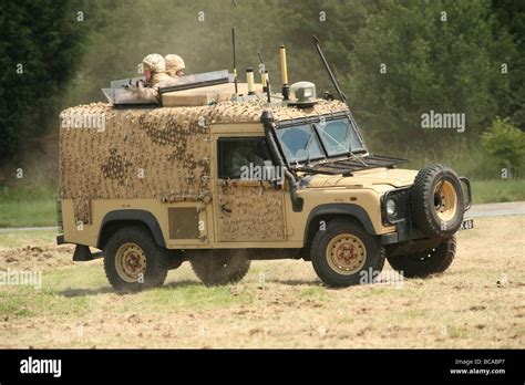 A British Army Land Rover snatch vehicle in desert camouflage on an ...