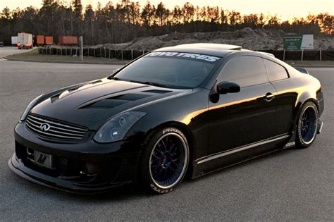 a black sports car parked in a parking lot