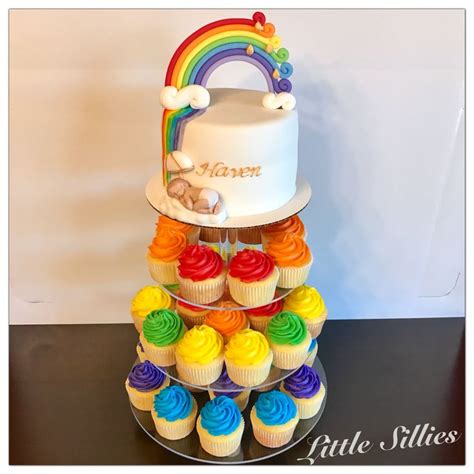 A cake and cupcakes for a rainbow themed baby shower | Rainbow theme baby shower, Rainbow baby ...