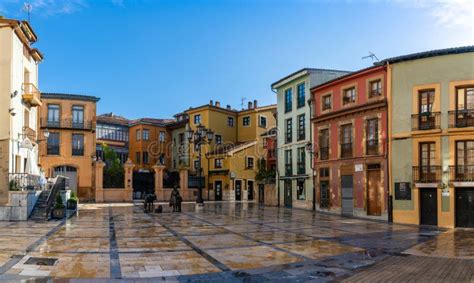 Donkey and Milkmaid Statue in the Historic Old Town of Oviedo with Colorful Buildings in the ...