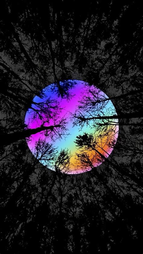 The rainbow infused moon between the trees is enlightening | Dark phone ...