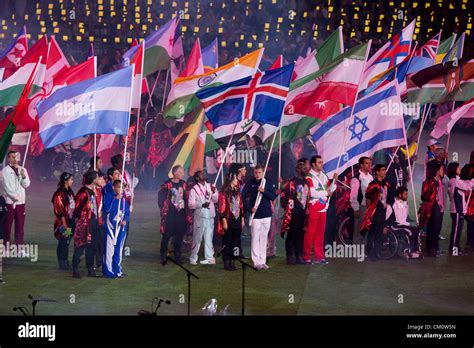 Athletes carry their countries' flags into Olympic Stadium at the closing ceremony of the 2012 ...
