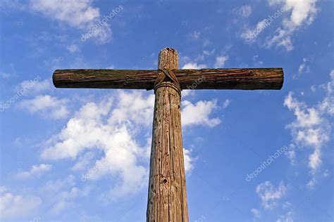 A rugged wooden Cross and blue, cloudy sky Stock Photo by ...