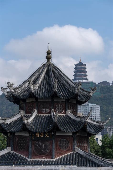 Brown and Black Temple Under White Clouds · Free Stock Photo