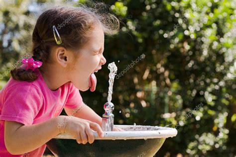 Kid Drinking Water From Fountain