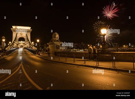 The famous Szechenyi Chain Bridge in Budapest by night with firework in ...