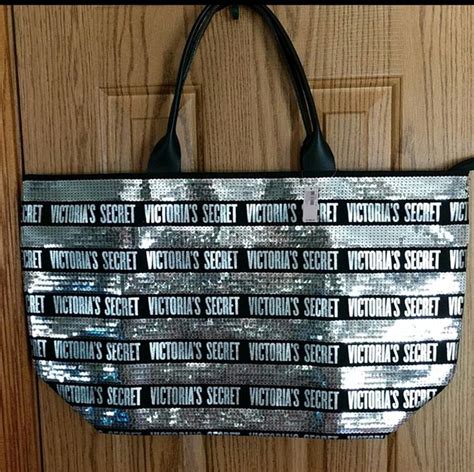 Large nwt Victoria's Secret tote with matching cosmetic bag. The tote measures 23" X 13.3" & t ...