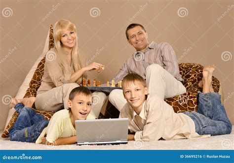 Family of four having fun stock photo. Image of cushion - 36695216