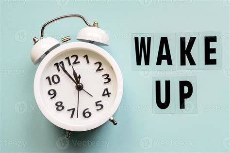 Wake up inscription. Alarm clock with wake up text on blue background ...