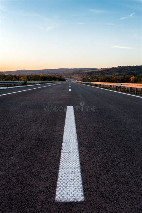 Empty highway at sunset stock image. Image of scenery - 105300833