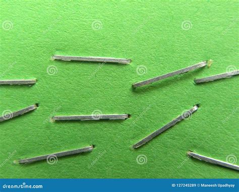 Many staples on paper stock image. Image of isolated - 127245289