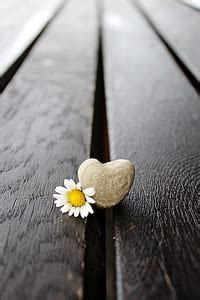 Royalty-Free photo: Heart-shaped gray stone on wooden panels | PickPik