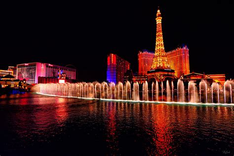 Bellagio Fountain Show at Night Photograph by Greg Norrell - Pixels