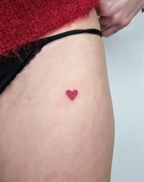 Details more than 76 tiny red heart tattoo latest - in.cdgdbentre