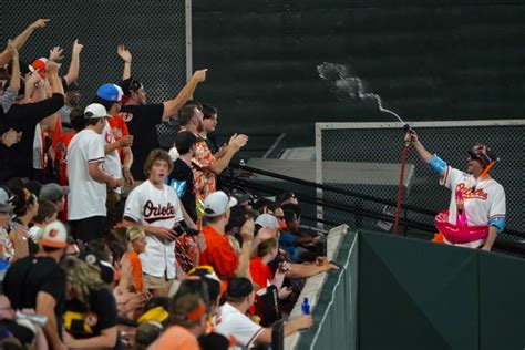 Mr. Splash sprays fans in the Bird Bath Splash Zone during the ...