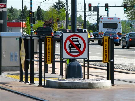 Light rail safety signs | 'Danger: High Voltage', 'Look both… | Flickr