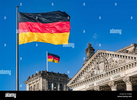 The German flag in front of the Reichstag in Berlin as symbol of ...