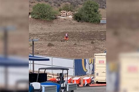 Fan in Broncos Jersey Watches Von Miller Outside Rams' Field