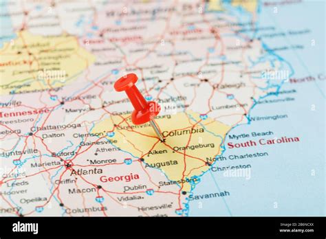 Red clerical needle on a map of USA, South South Carolina and the capital Columbia. Close up map ...