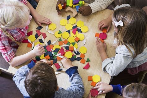 Children at preschool playing with colorful shapes - Meriton