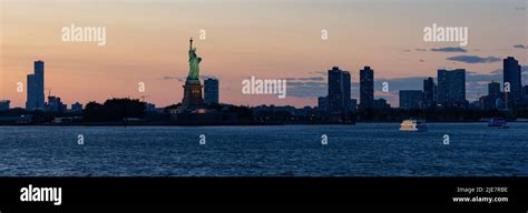 Statue of Liberty at sunset Stock Photo - Alamy