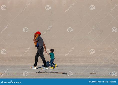 Haitian Man Walks with His Son Hand in Hand To Turn Himself in To the Border Patrol To Request ...