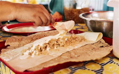 Hands making Nicaraguan Quesillo. Central American food the Quesillo ...