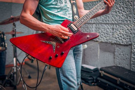 Man playing electric guitar in studio · Free Stock Photo