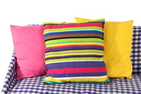 Premium Photo | Colorful pillows on couch isolated on white