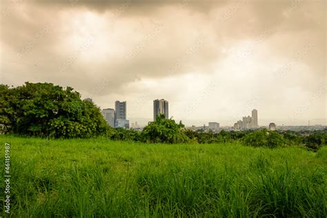 Metro Manila skyline as seen from Quezon City with colorful clouds and ...